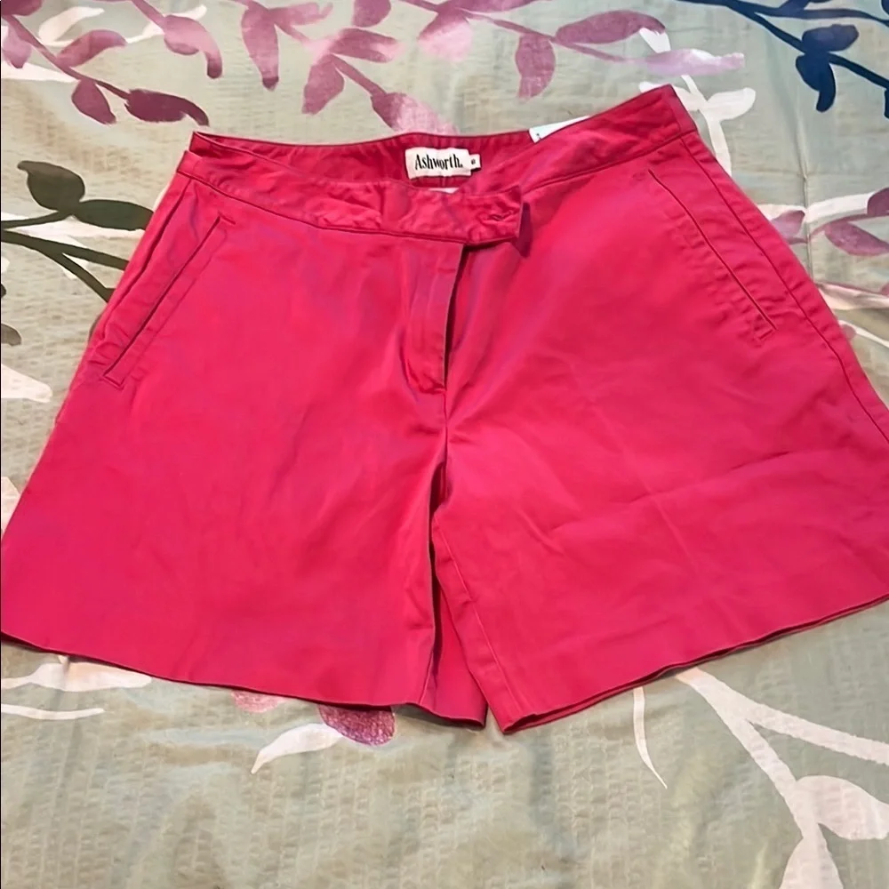Hot pink shorts.
